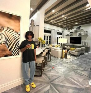 Abraham Attah displays his opulent living area and flaunts his brand-new, thick, long dreadlocks.